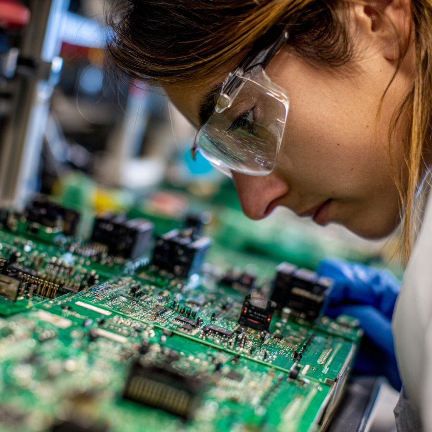 Woman working on PCB board